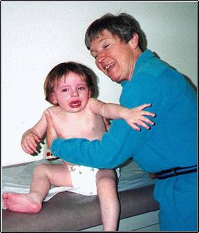 Millie with Dr. Braille, who diagnosed her fast and helped save her life.